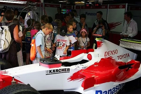 Formula One World Championship: Children are shown around the Toyota pit
