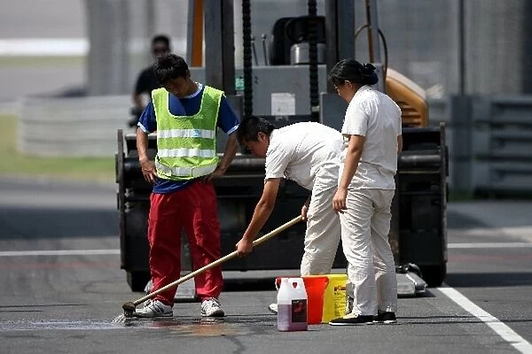 Formula One World Championship: Cleaners in the pitlane