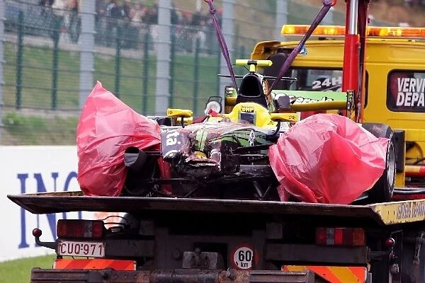 Formula One World Championship: The crashed car of Alvaro Parente Super Nova Racing is recovered to the pits