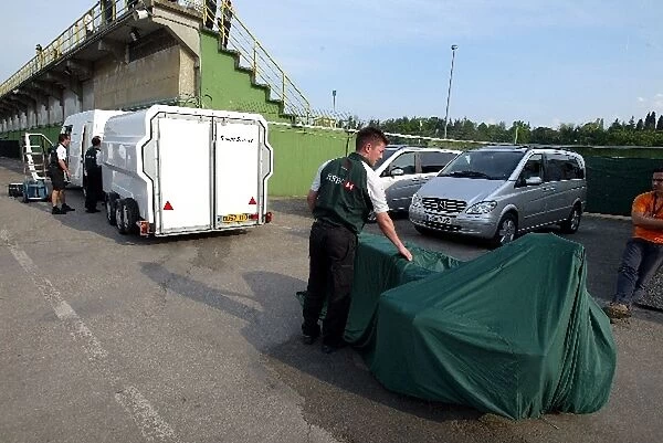 Formula One World Championship: The damaged carbon fibre tub of Christian Klien Jaguar Cosworth R5 is packed away to be sent home and repaired