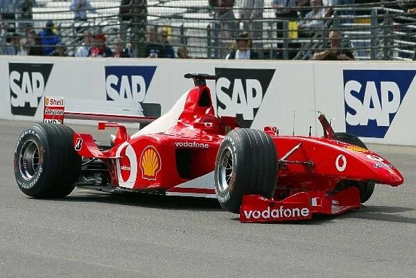 Formula One World Championship: The damaged Ferrari F2002 of Rubens Barrichello following his big crash into the wall on the banked final corner