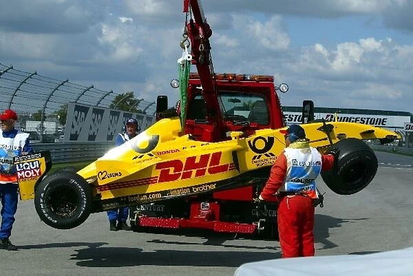 Formula One World Championship: The damaged Jordan EJ12 of Takuma Sato is rescued from the track