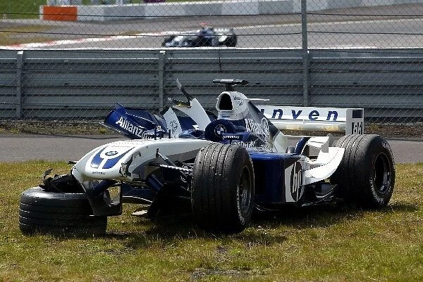 Formula One World Championship: The damaged and retired Williams BMW FW26 of Ralf Schumacher as team mate Juan Pablo Montoya Williams BMW FW26