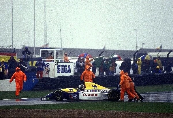 Formula One World Championship: Damon Hill, Williams FW15C, is pushed off the track by marshals