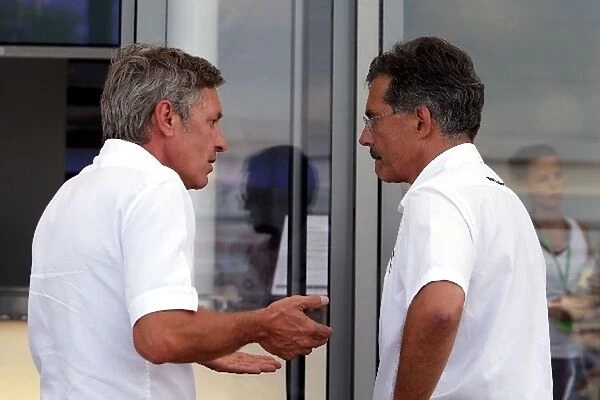 Formula One World Championship: Daniel Morelli driver manager talks with Dr Mario Theissen BMW Sauber F1 Team Principal