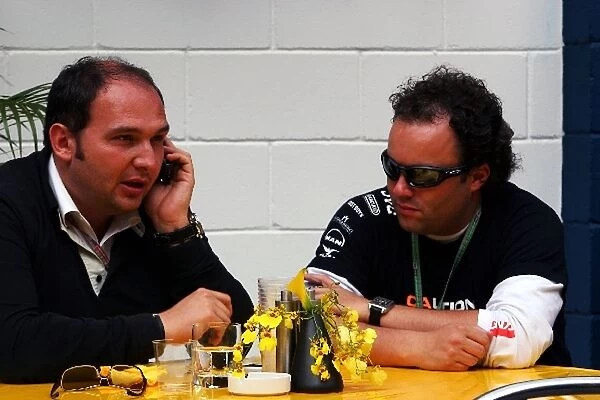 Formula One World Championship: Dr Colin Kolles Jordan Team Manager talks with Lodewijk Varossieau manager of Christijan Albers Minardi