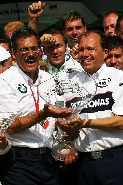 Formula One World Championship: Dr Mario Theissen BMW Sauber F1 Team Principal and Willi Rampf BMW Sauber Technical Director celebrates the team s