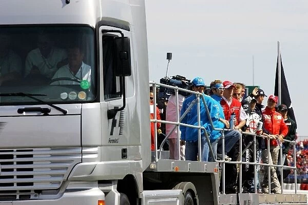 Formula One World Championship: The drivers parade truck heads off