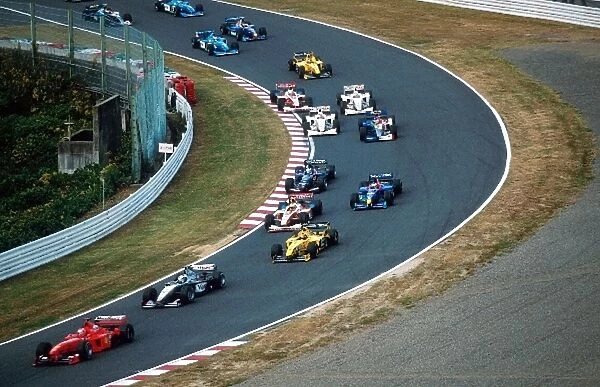 Formula One World Championship: Eddie Irvine Ferrari F399 leads the pack