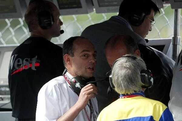 Formula One World Championship: Edouard Michelin Michelin Boss talks with Ron Dennis McLaren Team Principal and Pierre Dupasquier Michelin Director
