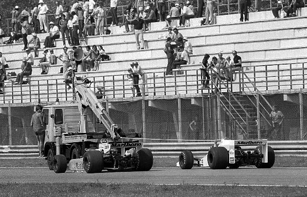Formula One World Championship: Eighth placed Patrick Tambay McLaren M28 passes a Team Agostini Marlboro Williams FW06 as it is pulled back to