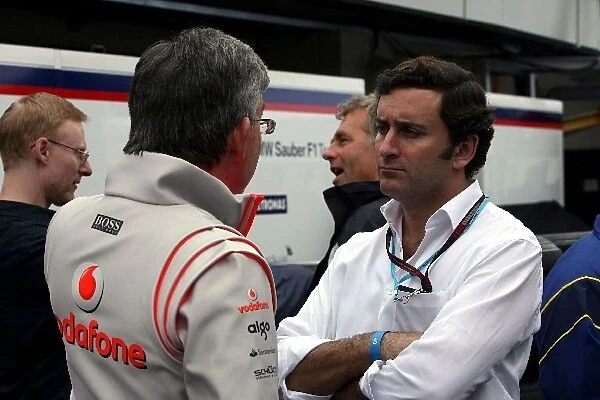 Formula One World Championship: Ekrem Sami Head of McLaren Marketing talks with Alejandro Agag