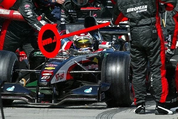 Formula One World Championship: Eleventh placed Jos Verstappen Minardi Cosworth PS03 makes a pit stop