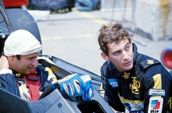 Formula One World Championship: Elio de Angelis Lotus 97T confers with teammate Ayrton Senna