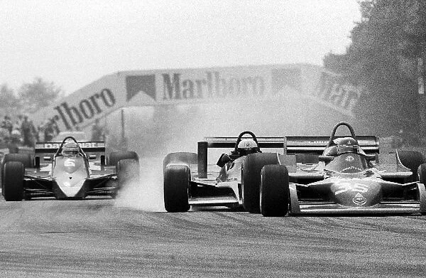 Formula One World Championship: Elio de Angelis Shadow DN9 crashes into the back of Bruno Giacomelli in the new Alfa Romeo 177 on lap 22, forcing