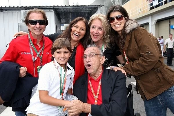 Formula One World Championship: Emerson Fittipaldi and family members in the paddock with guests
