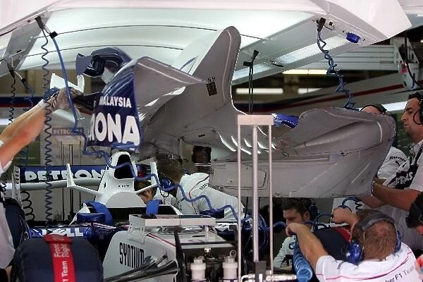 Formula One World Championship: Engine cover is removed on the car of Nick Heidfeld BMW Sauber F1. 07