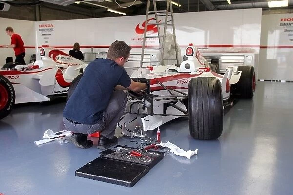 Formula One World Championship: A engineer prepares a Super Aguri F1 Car before the British Grand Prix