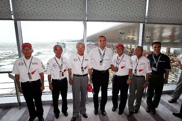 Formula One World Championship: Executives from Matsushita and Michelin with Dr. Akihiko Saito Toyota Executive Vice-President