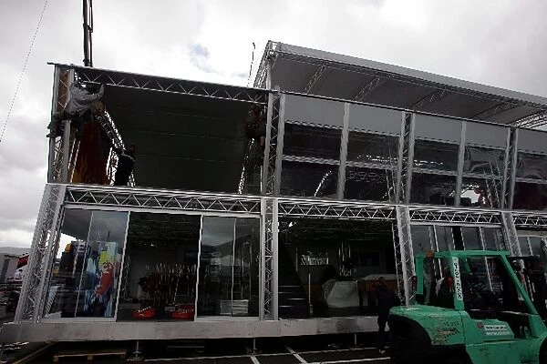 Formula One World Championship: Some extreme builders working on the Red Bull Racing Energy Station in the Silverstone paddock