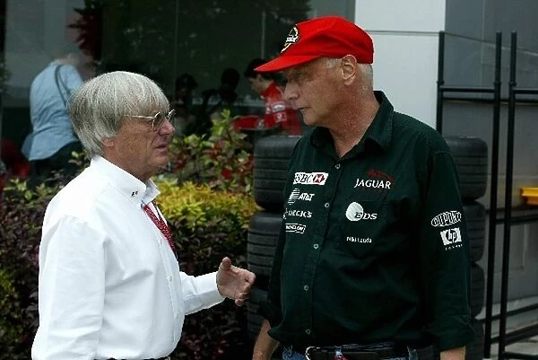 Formula One World Championship: F1 Supremo Bernie Ecclestone talks with Jaguar Team Principal Niki Lauda