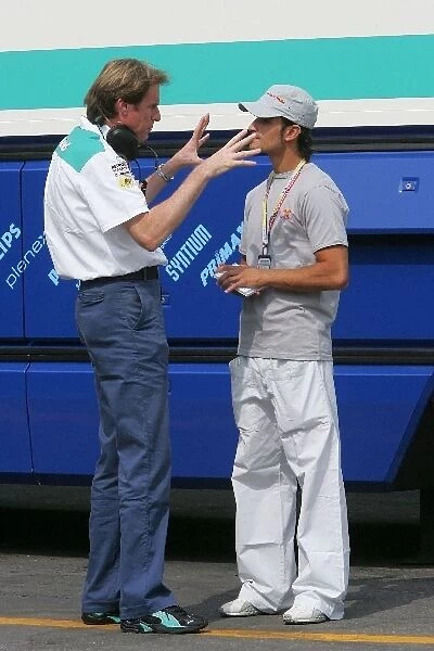 Formula One World Championship: F3000 Champion Vitantonio Liuzzi Arden International talks with a Sauber mechanic