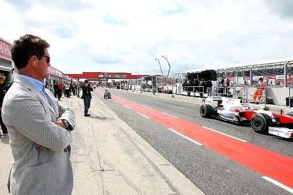Formula One World Championship: Fabio Capello England Football Manager watches Timo Glock Toyota TF109 leave the pits