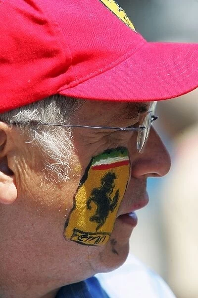 Formula One World Championship: Face painted Ferrari fan