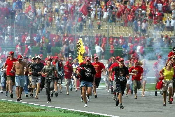 Formula One World Championship: Fans invade the track at the end of the race