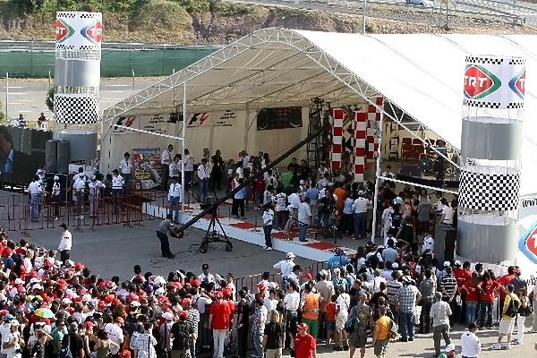Formula One World Championship: Fans queue for the autograph session