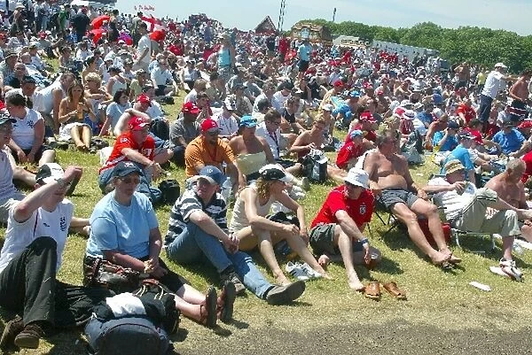 Formula One World Championship: Fans watch the football on the big screen
