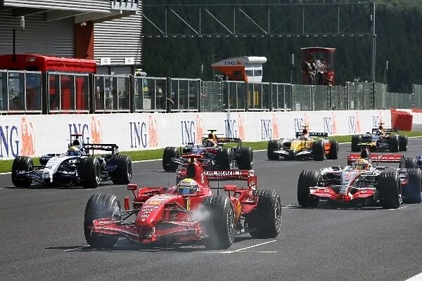 Formula One World Championship: Felipe Massa Ferrari F2007 has his brakes smoking at the start of the race