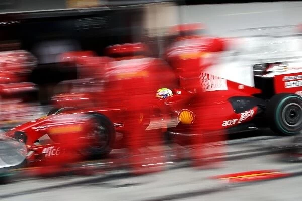 Formula One World Championship: Felipe Massa Ferrari F2009 makes a pit stop during qualifying