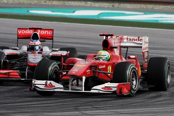 Formula One World Championship: Felipe Massa Ferrari F10 and Jenson Button McLaren MP4  /  25 battle for position