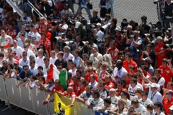 Formula One World Championship: Ferrari and BMW mechanics celebrate in parc ferme