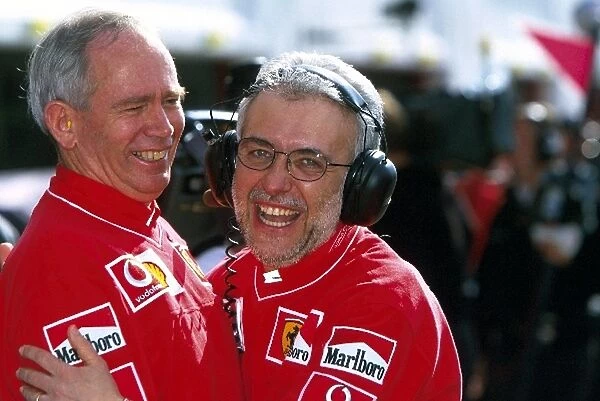 Formula One World Championship: Ferrari designer Rory Byrne and Stefano Govoni Head of Ferrari Customer Engines celebrate the teams 1-2 finish