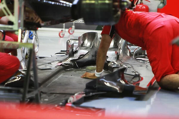 Formula One World Championship: Ferrari F10 worked on by mechanics