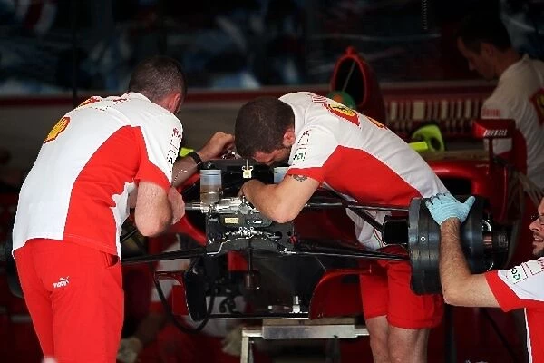 Formula One World Championship: Ferrari F2007 worked on by mechanics