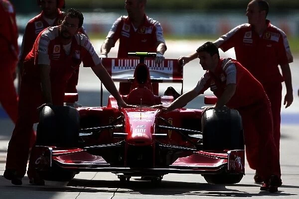 Formula One World Championship: Ferrari F2009 of Kimi Raikkonen Ferrari pushed down the pit lane