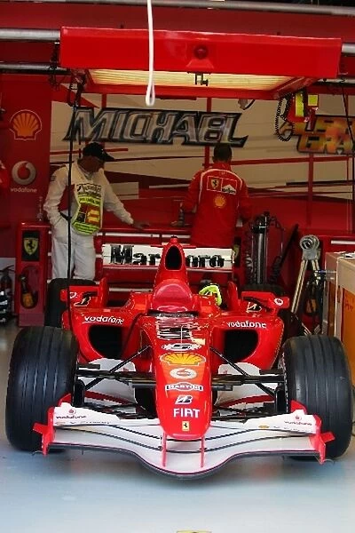 Formula One World Championship: Ferrari F248 F1 of Michael Schumacher Ferrari in parc ferme