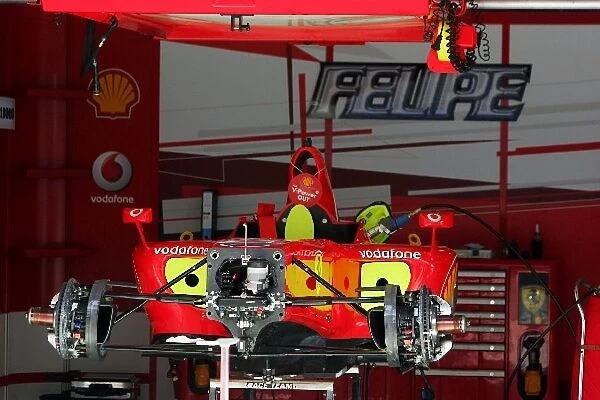Formula One World Championship: Ferrari F248 F1 in the pits stripped down