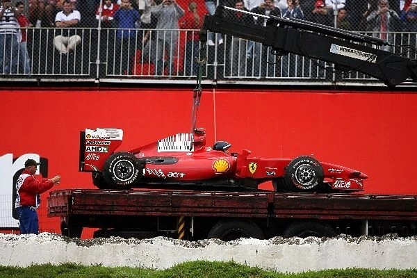 Formula One World Championship: The Ferrari F60 of Giancarlo Fisichella Ferrari is recovered to the pits