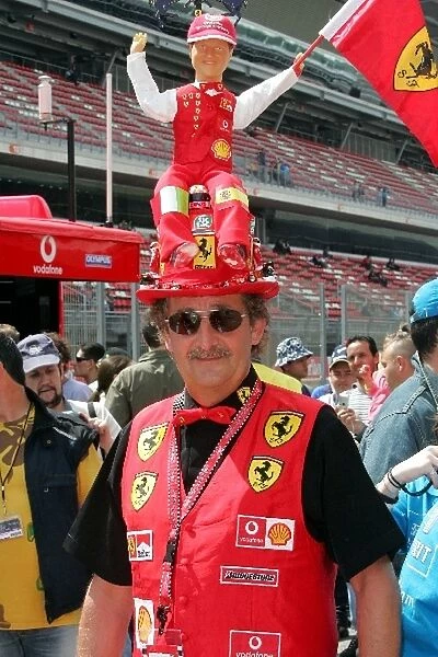 Formula One World Championship: A Ferrari fan with a large hat