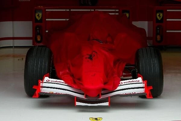 Formula One World Championship: The Ferrari of Michael Schumacher Ferrari F2005 in the garage under a cover