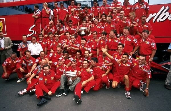 Formula One World Championship: The Ferrari team celebrate Irvines victory
