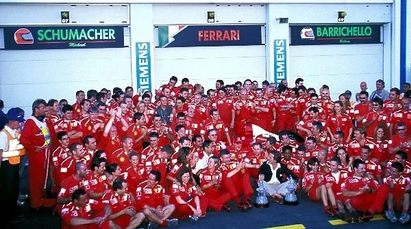 Formula One World Championship: The Ferrari team celebrate clinching their third Drivers World Championship in a row and Michael Schumacher s