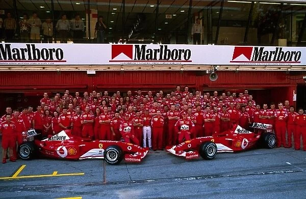 Formula One World Championship: The Ferrari team celebrate the win for Michael Schumacher and the launch of the F2003-GA