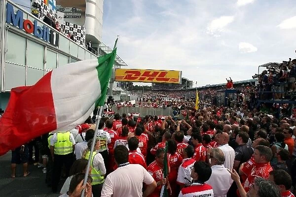 Formula One World Championship: Ferrari team members below the podium