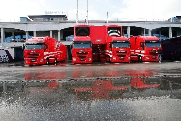 Formula One World Championship: Ferrari trucks in a wet paddock