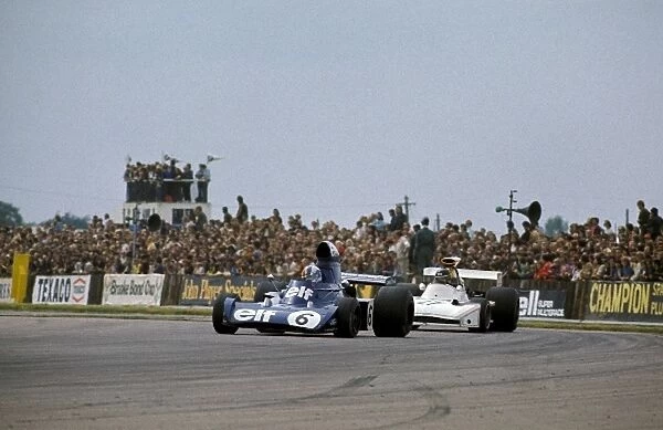 Formula One World Championship: Fifth placed Francois Cevert Tyrrell 006 leads James Hunt Hesketh Racing March 731, who scored his, and the team├òs
